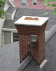 A chimney with two clay-tile flue liners