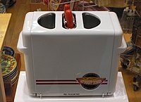 Toaster for hot dog buns that grills hot dogs at the same time