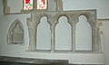 Early English piscina (left) and sedilia in the chancel of St Denys' parish church