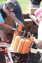 Clay pigeons being loaded into an automatic thrower