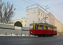 The original ghetto tram in front of the Umschlagplatz Monument