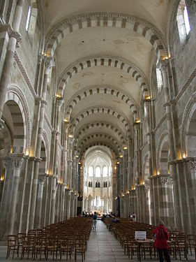 Vézelay Abbey has clusters of vertical shafts rising to support transverse arches and a groin vault. The east end is Gothic.