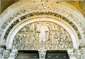 Ornate sculpture covering the arch above a doorway
