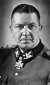 a black and white photograph of Theodor Eicke in SS dress uniform