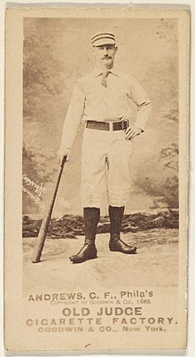 Man standing holding baseball bat