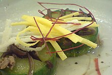 Oi-seon (stuffed cucumber) topped with sil-gochu