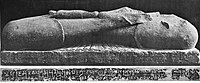 Fragment of a Bodhisattva sculpture inscribed "in the year 33" (𑀲𑀁𑁝𑁔) of "the Great King, son of God, Huvishka" (Mahārājasya Devaputrasya Huviṣka, ), Art of Mathura.[11]