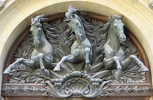 Tympanum over the door to the former stables from the Cour Lefuel