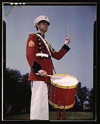 Charles Owen, a marimba soloist and timpanist, beating a drum at Marine Barracks Washington, May 1942