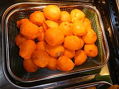 Kwek kwek, deep-fried quail eggs in batter, a popular street food snack in the Philippines