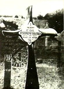 Crucifix, made from an aeroplane propeller, in a cemetery. The inscription reads "Lt. Col. R.S. Dallas DSO DSC ... Killed in Action" 1 June 1918