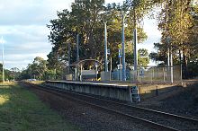 The tired single platform of Baxter station in a rural environment