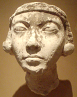 Plaster face of a young Amarna-era woman, (thought by many to represent Kiya, one of Akhenaten's wives), from late in Akhenaten's reign, years 14–17, from the workshop of the sculptor Thutmose, on display at the Metropolitan Museum of Art, New York City