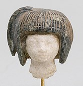 Head from a spoon in the form of a swimming girl; 1390–1353 BC; travertine (the head) and steatite (the hair); 2.8 × 2.7 cm; Metropolitan Museum of Art