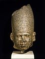 The head of a King, c. 2650–2600 BC, Brooklyn Museum. The earliest representations of Egyptian Kings are on a small scale. From the Third Dynasty, statues were made showing the ruler life-size. This head wearing the crown of Upper Egypt is larger than human scale.[9]