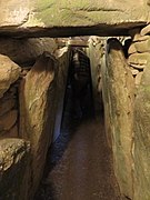 Orthostat-lined passage leading towards tomb chamber