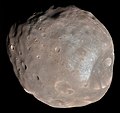 Image 14 Phobos (moon) Photo credit: Mars Reconnaissance Orbiter Phobos, the larger and closer of the two moons of Mars, as seen from about 6,000 kilometres (3,700 mi) away. A small, irregularly shaped object, Phobos orbits about 9,377 km (5,827 mi) from the center of Mars, closer to its primary than any other planetary moon. The illuminated part of Phobos seen in the images is about 21 km (13 mi) across. The most prominent feature in the images is the large crater Stickney in the lower right. With a diameter of 9 km (5.6 mi), it is the largest feature on Phobos. More selected pictures