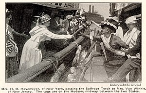 "Mrs H. O. Havemeyer, of New York, passing the Suffrage Torch to Mrs. Van Winkle, of New Jersey." August 7, 1915