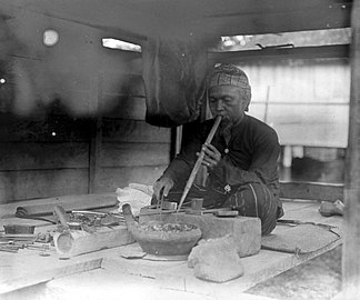 A Karo people (Indonesia) goldsmith in Sumatra (c. 1918)