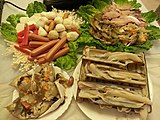 Typical ingredients for Cantonese style hotpot are razor shell (蟶子), crab (蟹), prawn (蝦), chicken sausage (雞肉腸仔) and dace fishball (魚旦)
