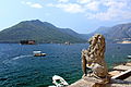 Stone lion and the Bay of Kotor. Perast, Montenegro.