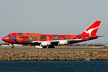 A Boeing 747-400ER in 2006 wearing the Wunala Dreaming livery. From 2003 to 2012, it was the second aircraft to carry the colour scheme.