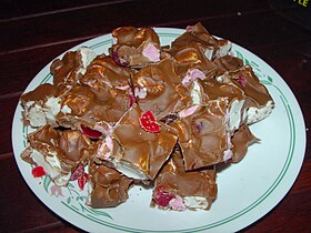 Cherries with pink and white nougat covered in chocolate