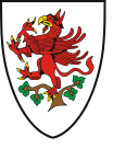 Similarly, the coat of arms of Greifswald, Germany, in Mecklenburg-Vorpommern, also shows a red griffin rampant – perched in a tree, reflecting a legend about the town's founding in the 13th century.