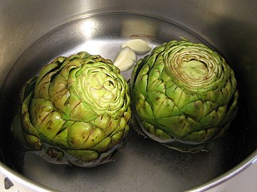 Globe artichokes being cooked