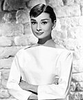 Black-and-white publicity photo of Audrey Hepburn in 1956.