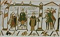 The 11th-century Bayeux Tapestry makes extensive use of tituli to explain the complicated story: "HIC RESIDET HAROLD REX ANGLORUM" and "STIGANT ARCHIEPS".