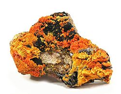 Francevillite (orange) with Curienite (yellow) and Chervetite, Mounana Mine, Franceville, Haut-Ogooué Province, Gabon. Overall size 8.7 x 6.1 x 2.1 cm.