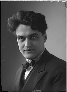 black and white portrait photo from 1923 showing Oltramare with a penetrating stare