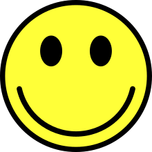 Graphic of a classic smiling face ideogram, yellow, with black borders against a white background