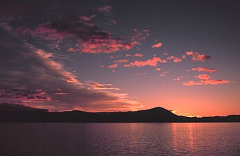 Sunrise in southeast Alaska. Sunsets and sunrises are sometimes pink because of an optical effect called Rayleigh scattering.