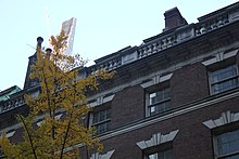 Detail of top of the house with 111 West 57th Street in the background