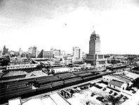 View toward the southeast of the city center, with passenger trains and the Dade County Courthouse foreground, c. 1930s