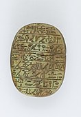 The back of a heart scarab of the singer of Amun Iakai; 1550–1186 BC; glass; length: 4.8 cm, width: 3.5 cm, height: 1.5 cm; Metropolitan Museum of Art