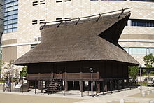 Brown building with an angular roof