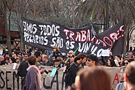 Crowd with banner in the Geração à Rasca demonstration in Lisbon, 12 March 2011.