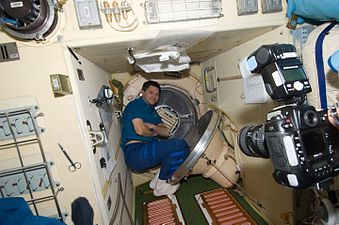 Oleg Kononenko is pictured near a hatch in the Pirs Docking Compartment.