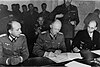 Alfred Jodl signing the WWII capitulation papers