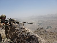 KCT sniper with an Accuracy International Arctic Warfare rifle during a mission in southern Afghanistan.
