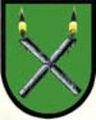 Das alte, bis 2015 gültige Wappen der Gemeinde Sankt Blasen. Die beiden gekreuzten Kerzen weisen auf den Blasiussegen hin.