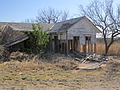Abandoned buildings, such as this one located off US Route 84 in northern Scurry County, are seen throughout the South Plains. This building was the Dermott Post Office located in Dermott, Scurry County, TX. It had an attached home for the postmaster.