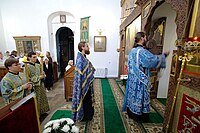 Orthodox priest and deacon making the Entrance with the censer at Great Vespers