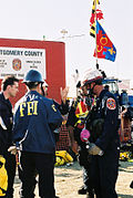 Federal Emergency Management Agency Urban Search and Rescue (U S & R) team members from nearby Montgomery County, Maryland, coordinate with members of the Federal Bureau of Investigation before entering the crash site at the Pentagon