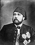 Formal photograph of a bearded Isma'il Pasha, wearing a fez