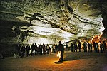 Visitors with a guide inside a cave