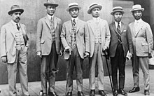 Six formally-dressed men